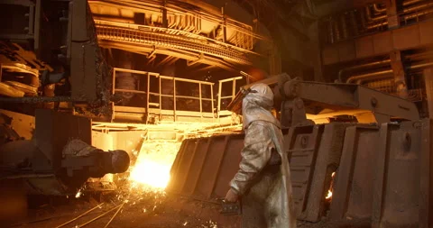 Metal casting process in metallurgical plant. Liquid metal pouring into molds Stock Footage 231006576