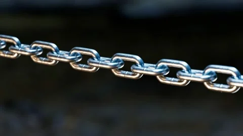 A metal chain is blown to pieces. Breaks chains. Regains freedom. Break free. Stock Footage