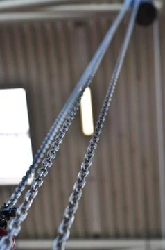 Metal chain on  a dark ceiling background Stock Photos