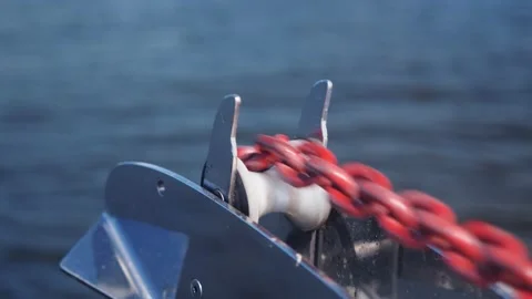 Metal chain moves on roller while yacht comes to anchor Stock Footage 138728062