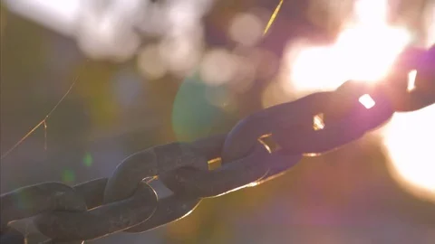 Metal chain on sunlight background Stock Footage 78058393