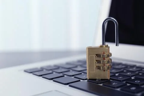 Metal code padlock on laptop keyboard, space for text. Cyber security concept 스톡 사진