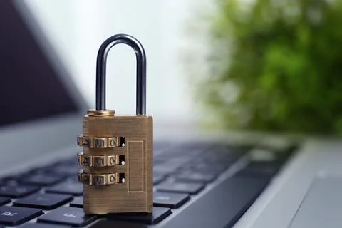 Metal code padlock on laptop keyboard, space for text. Cyber security concept 스톡 사진