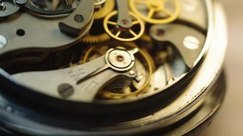 Metal cogwheels inside clockwork.  Tick-Tick Sound Stock Footage 64258188