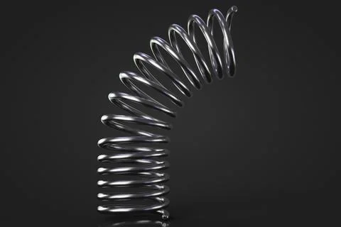 The metal coil spring is bent. Dark background. Close-up. Stock Illustration