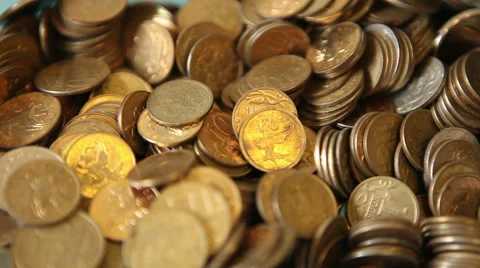 Metal coins falling into a pile, close-up Stock Footage 60802454