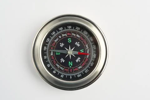 Metal Compass on White Background – Navigation Tool Close-Up Stock Photos