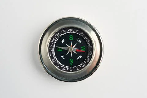 Metal Compass on White Background – Navigation Tool Close-Up Stock Photos