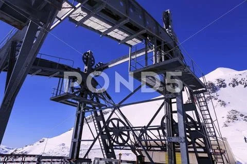 Metal construction cableway in the mountains in the french alps Stock Photos