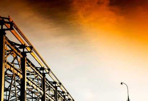 Metal construction frames under sunset sun background Stock Photos