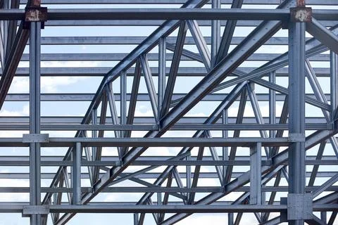 Metal construction texture pattern. Urban geometrical interlacing of bolted c Stock Photos