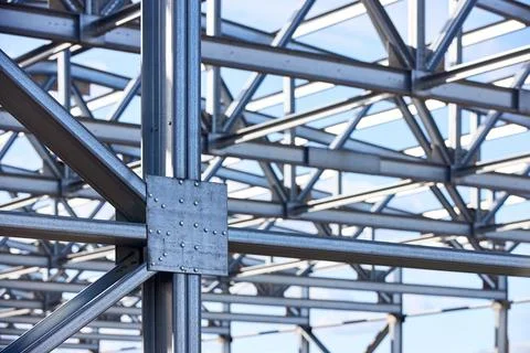 Metal construction texture pattern. Urban geometrical interlacing of bolted c Stock Photos