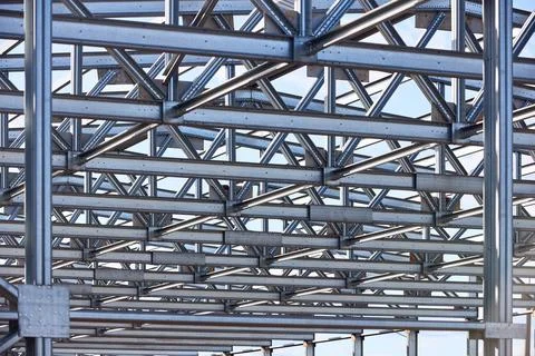 Metal construction texture pattern. Urban geometrical interlacing of bolted c Stock Photos