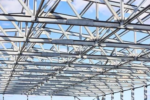 Metal construction texture pattern. Urban geometrical interlacing of bolted c Stock Photos