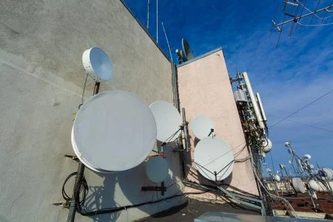 Metal constructions with telecommunication data equipment, satelite dishes Stock Photos
