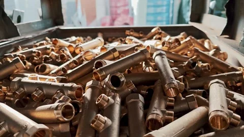Metal container full of raw brass pipes at the factory. Process of creating Video stock 329320425