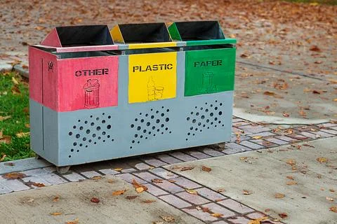 Metal container, garbage collection bin with three sections marked for sort.. Stock Photos