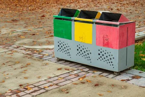 Metal container, garbage collection bin with three sections marked for sort.. Stock Photos