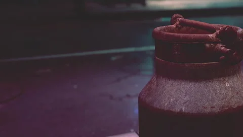 Metal container sits on street surface at night under streetlight Vidéo 343935737