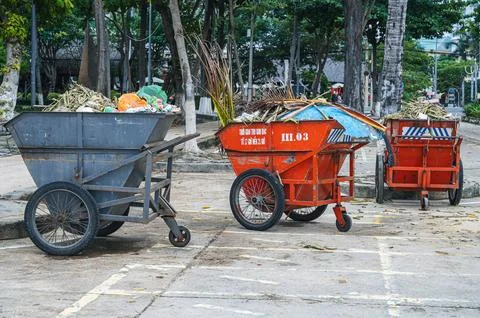 Metal containers full of garbage are standing on a beach in Asia. Nha Trang Stock Photos