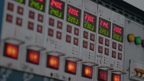 Metal control panel with many buttons, lights, switches on Industrial equipment Stock Footage 228065543
