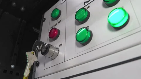 Metal control panel with many lights red button for turning on and emergency off Stock Footage 249616870