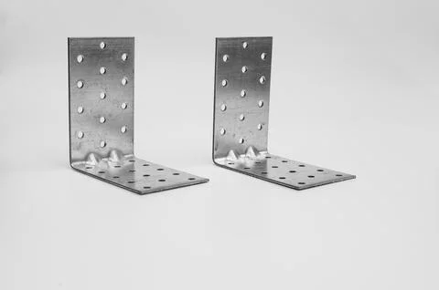 Metal corners as a connecting element. on a white background Stock Photos