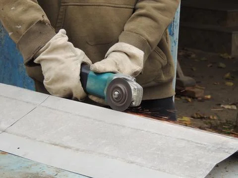 Metal cutter in the process of work Stock Photos