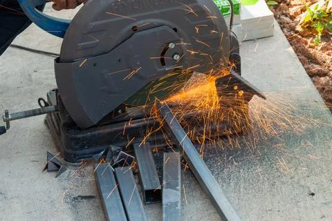 Metal cutting action workshop tools sparks close-up industrial process for .. Stock Photos