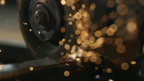Metal cutting with angle grinder creating bright sparks in workshop environ.. Stock Footage 337604570