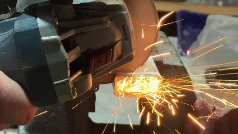 Metal cutting with angle grinder in workshop Stock Footage 326967628