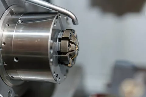 Metal cutting tool set in a machine showing details of the working part dur.. Stock Photos