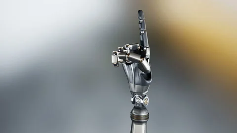 Metal cyborg robotic arm points index finger into viewer. 動画素材 98434663