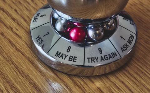 Metal decision maker with 'Maybe' selected from the wheel of options Stock Photos