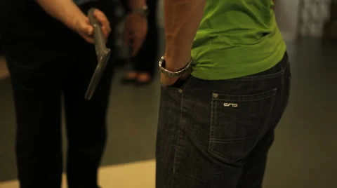 Metal detector, checking his pocket Vídeo Stock 41754219