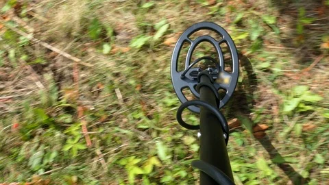Metal Detector in Use on Grassy Meadow POV Video stock 95274635
