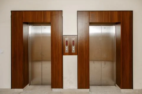 Metal doors to the Elevator.Elevator with call buttons Fotos de archivo
