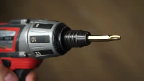 Metal drill bit rotates quickly in the drill, close macro Stock-Footage 140676835