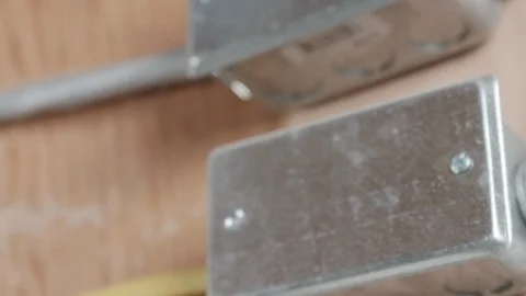 Metal Electrical Box Mounted to Wall CLOSE UP SLIDE LEFT Stock-Footage 104874251