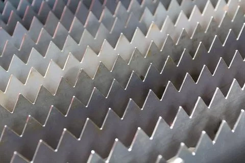 Metal elements in the form of triangles close-up. Backgrounds and textures Stock Photos