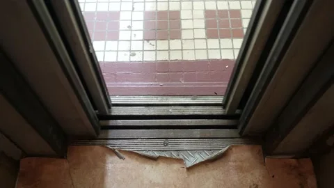 The metal elevator doors close automatically. Badly worn interior of an elevator Video stock 138598380
