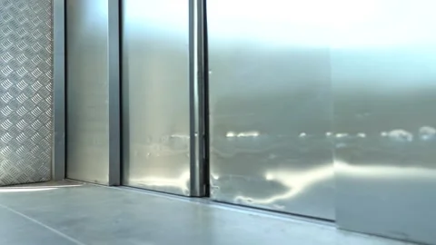 Metal elevator doors open Stock Footage 156187646