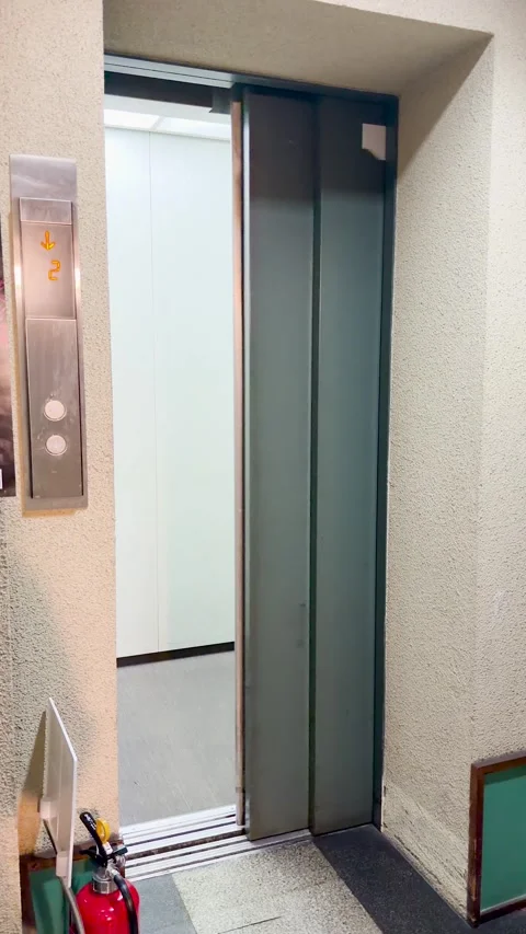 Metal Elevator Doors Opening in a Kyoto Apartment Building Hallway Stock Footage 333300397