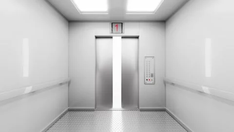 A metal elevator takes you to the desired floor and the doors open. Stock Footage 306240486