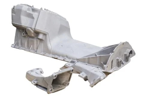 Metal engine component displayed against a textured gray background highlig.. Foto stock