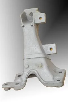 Metal engine component displayed against a textured gray background highlig.. Foto stock