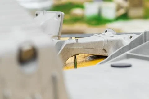 Metal engine component displayed against a textured gray background highlig.. Stock Photos
