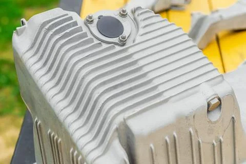 Metal engine component displayed against a textured gray background highlig.. Stock Photos