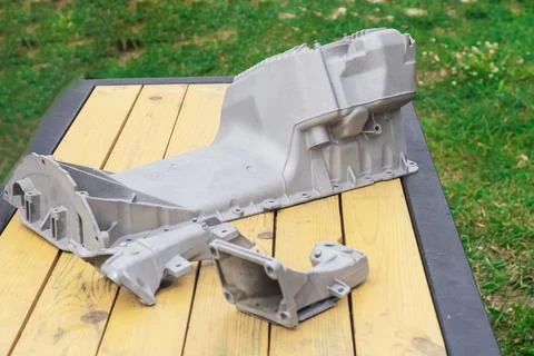 The metal engine component showcases intricate design features, capturing the Foto stock