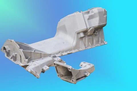 The metal engine component showcases intricate design features, capturing the Foto stock